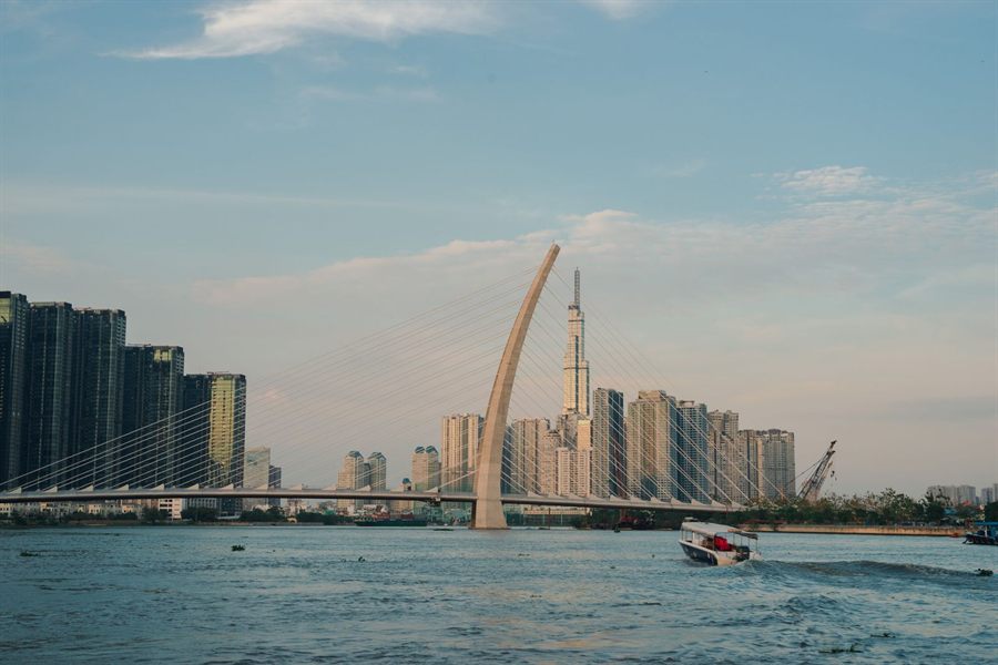 Ho Chi Minh City skyline and a new cable-stayed bridge across the Saigon River